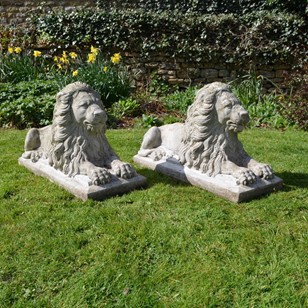 Pair of Recumbent Composition Lions